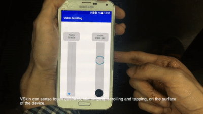 VSkin: Sensing Touch Gestures on Surfaces of Mobile Devices Using Acoustic Signals